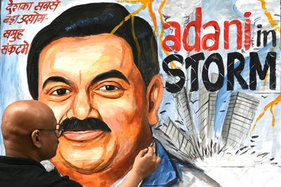 India's Adani inches back up after loan pledge