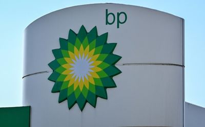 BP posts record profit, dilutes green target