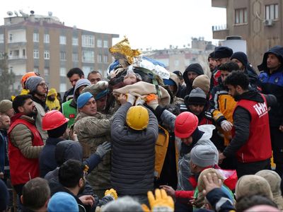 20,000 feared dead in earthquake carnage as rescuers race against time to save trapped victims