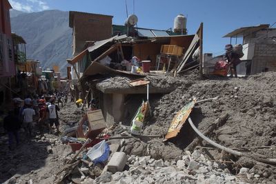 Mudslides smash 5 villages in Peru; death toll lowered to 12
