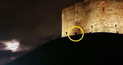 Stunned mum photos 'ghost with bullet hole through head' outside haunted castle