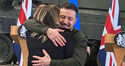 Sweet moment President Zelensky snubs security protocol to give Ukrainian reporter a hug