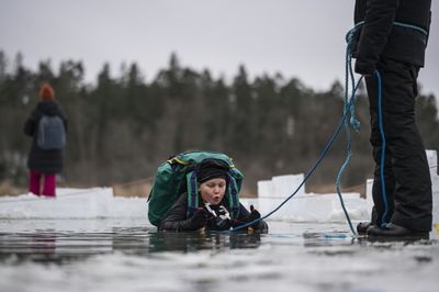 Swedish kids take the plunge in icy lake survival lessons
