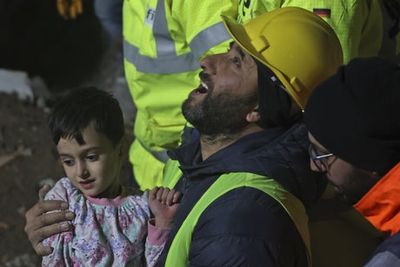 British rescuers help save mum and son trapped in earthquake rubble for 68 hours as death toll passes 19,300