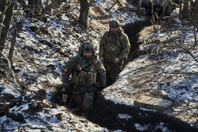 Russia attacks east Ukraine as milestone nears; Kyiv seeks arms