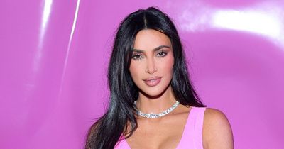 Kim Kardashian shows off impossibly tiny waist in Barbie pink outfit for SKIMS launch