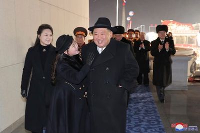 Kim Jong-un and young daughter take centre stage as North Korea shows off military arsenal