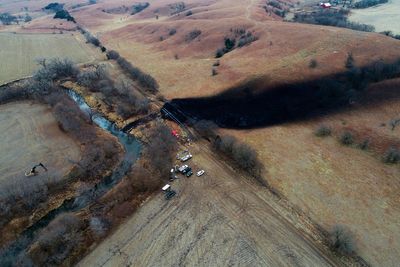 Firm: Faulty weld, pressure on pipe led to Kansas oil spill