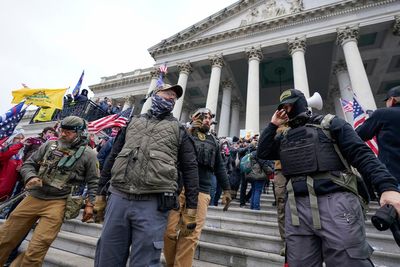 Jan 6 rioter who threatened Capitol officer with Confederate flag is jailed for three years