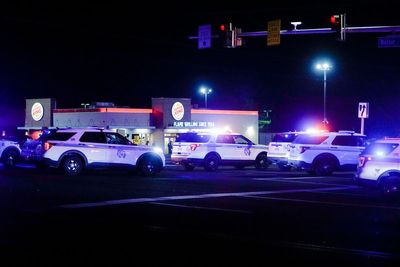 Second Maryland police officer shot as manhunt continues