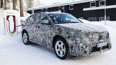 Prototype BMW iX2 EV Crossover Spied Charging At A Tesla Supercharger