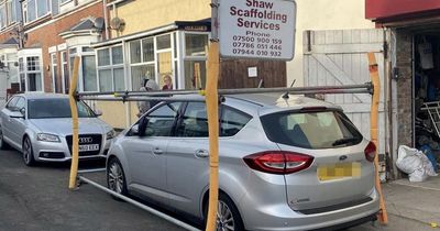 Man builds wall of scaffolding to blockade 'badly parked' car left outside warehouse