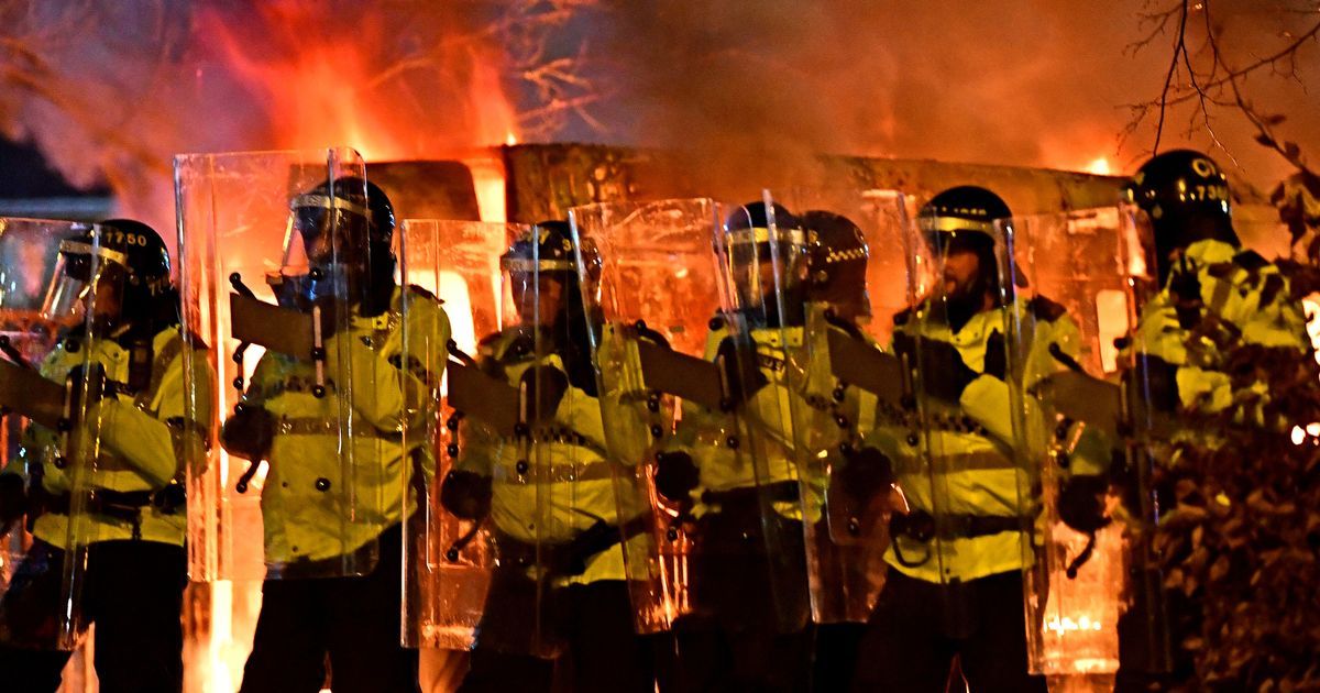 Protest turns into riot as police van set alight and…