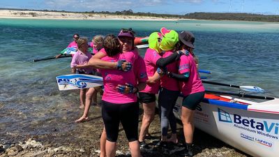 All-female surfboat crew celebrates 320km Bass Strait crossing to Tasmania's north-east