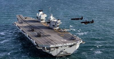 Royal Navy aircraft carrier chases away Chinese spy submarine