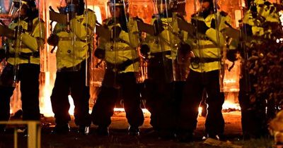 Three arrested after protest turns violent outside Merseyside hotel