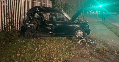 Black cab crash scatters debris over major Merseyside road