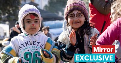 Traumatised child earthquake victims laugh with pals as experts help them forget