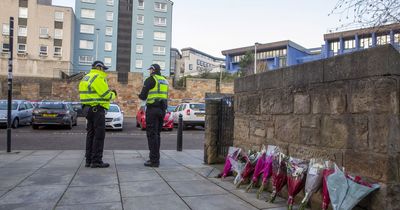 Edinburgh police guard site teenager lost his life as bouquets of flowers left