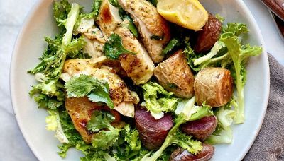 Warm chicken and fingerling salad starts on a sheet pan