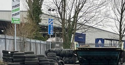 Council bosses threaten action over village's 'eyesore' tyre recycling site