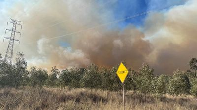Bushfires continue to burn in Queensland's Western Downs region, evacuated residents face anxious wait to assess the damage
