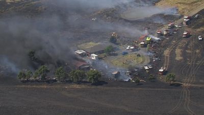 Grassfire at Bulla, on Melbourne's north-west fringe, brought under control with one building damaged