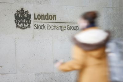 London stocks hit record peak, dollar drops before US inflation