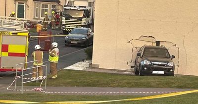 Car smashes into home on Scots street as emergency services seal off area