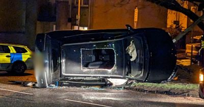 Dramatic pictures from Milngavie crash show smashed car on its side as diversions in place