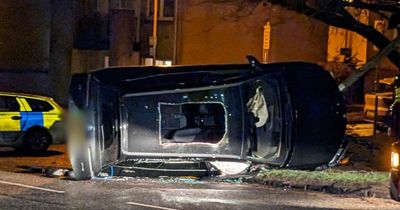 Dramatic scenes as car flipped up on to its side during crash on Scots road
