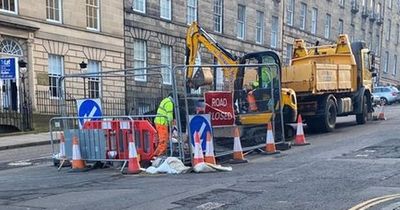 Massive 'sink hole' opens up on a busy UK street and reveals lost underground tunnel