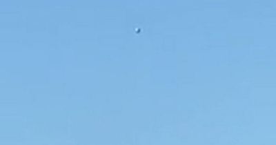 UFO or mystery balloon spotted flying through the sky