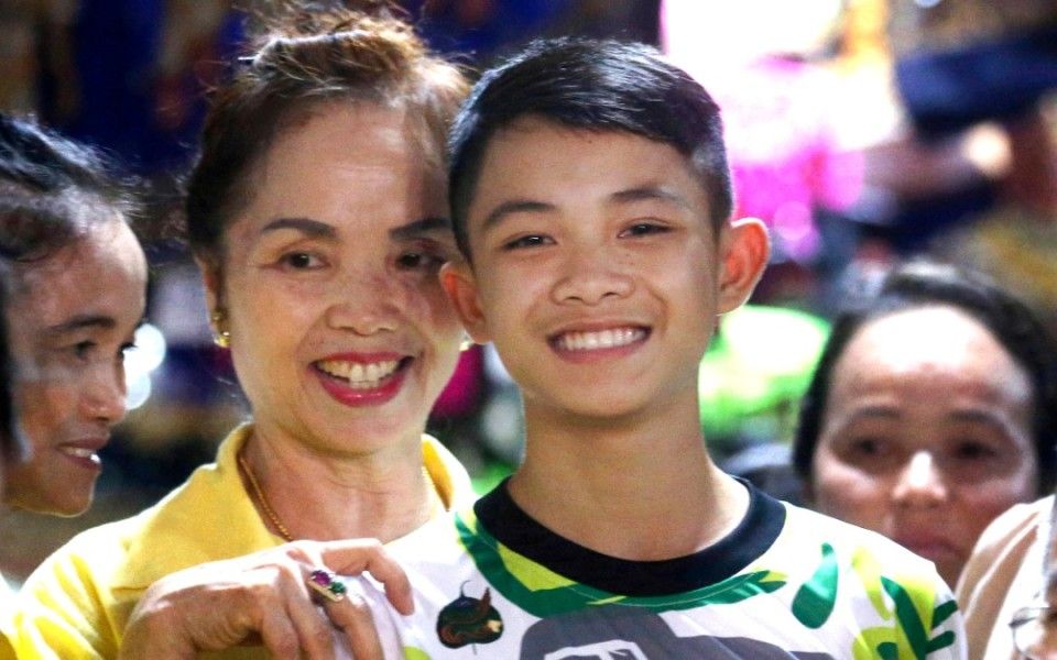 Grinning boy from Thai caves rescue dies in England