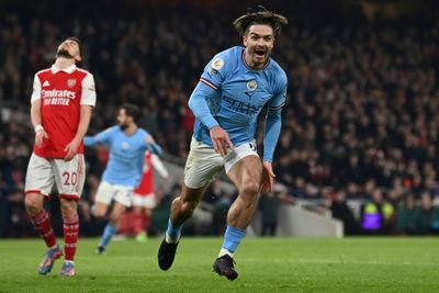 Slick Man City sink Arsenal to seize top spot in title race