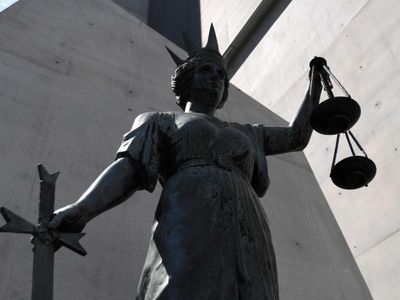 Woman faces court charged with murdering elderly man