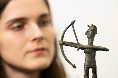 Ancient bronze archer figurine installed for Mediterranean islands exhibition