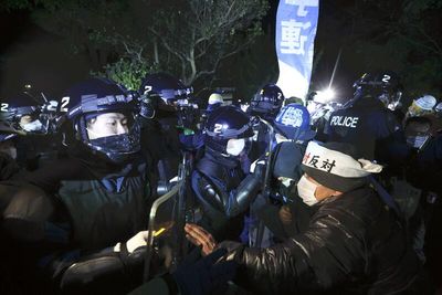 Narita Airport opponents clash with police as structures removed