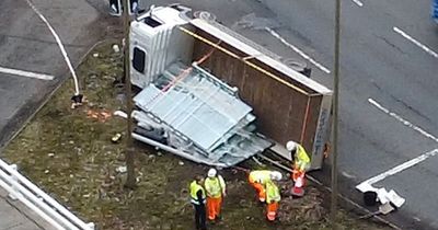 Overturned van on busy Edinburgh roundabout shuts major road and triggers delays