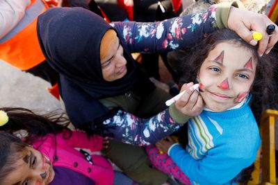 In Turkey camp, young quake survivors enjoy moment of normality with face painting