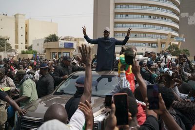 Senegal police smash car, forcibly remove opposition leader