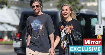 Louis Tomlinson holds hands with mystery blonde months after split from ex-girlfriend