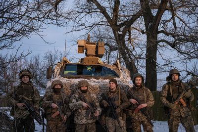 Ukrainian troops holding Bakhmut line demand weapons as world powers meet