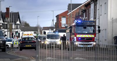 Man rescued from roof of house by firefighters after blaze breaks out