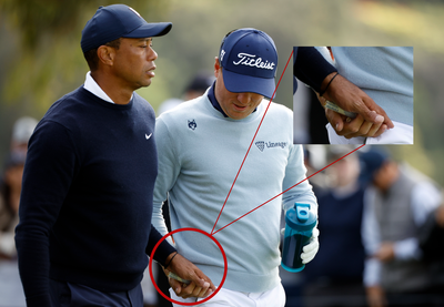 Tiger Woods gives tampon to playing partner Justin Thomas after outdriving him
