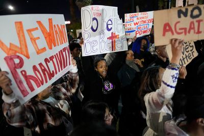 Nevada officer slams student recording police, kneels on him