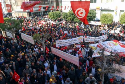 Powerful Tunisian trade union defies president with mass protests