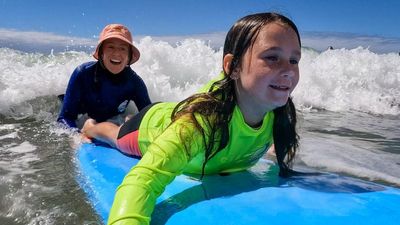 Surf therapy improves lives of children with disability, neurodiversity on NSW South Coast