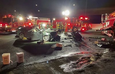 Tesla driver killed after car plows into fire truck shielding crew working on another accident