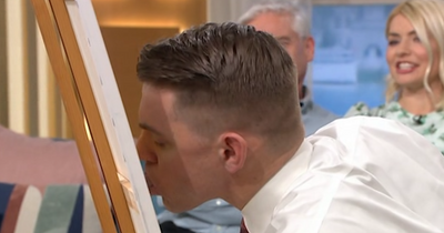 This Morning's Holly Willoughby blushes as she watches 'personal moment' of man with record breaking tongue